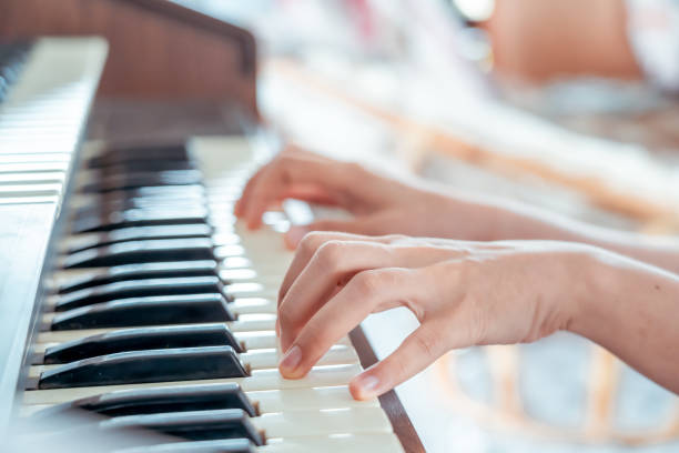 istock Female pianist hands on grand piano keyboard. 1316062184