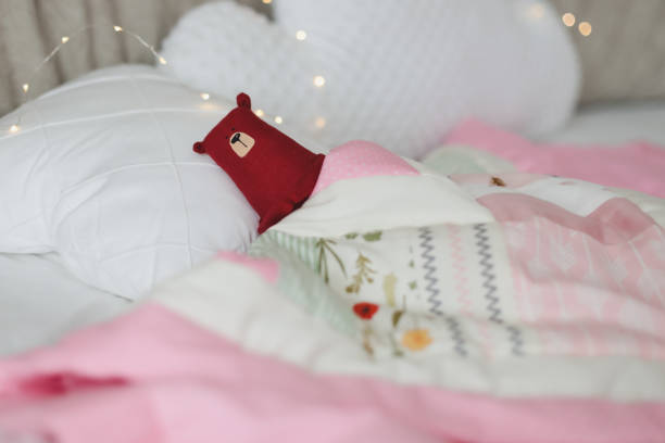 istock Cozy baby cot with pink patchwork blanket. Baby bedding. Bedding and textile for nursery. Nap and sleep time 1316064662