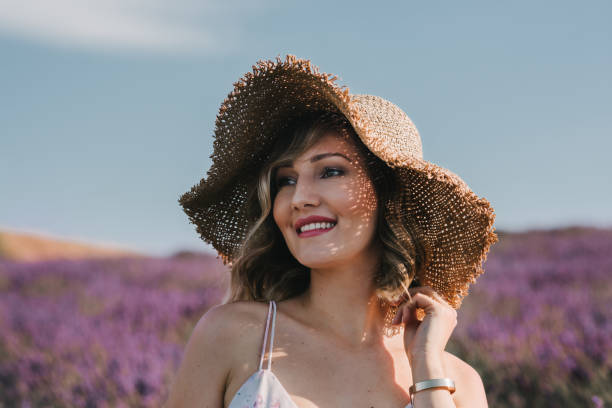 istock A young woman smiling in a lavender field 1316064668