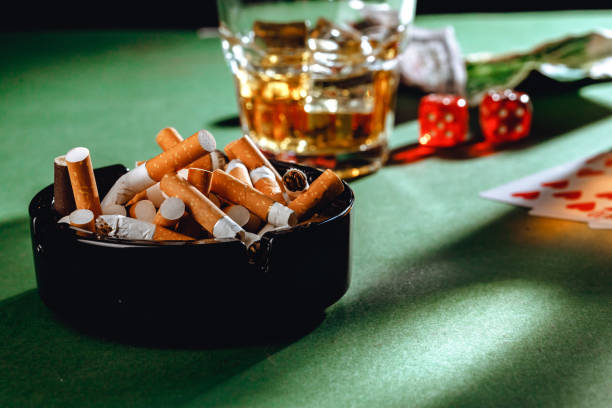 istock Playing poker with whiskey and cigars on table 1316067011