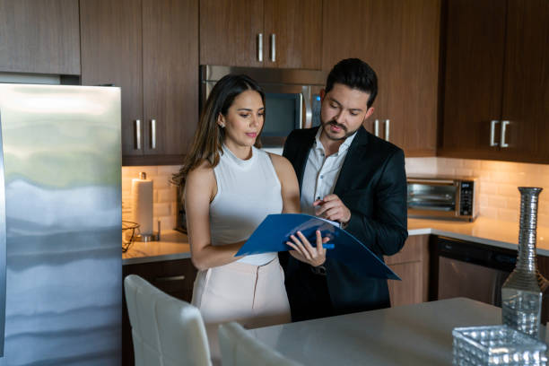 istock Real estate agent reading a contract with her client 1316069328