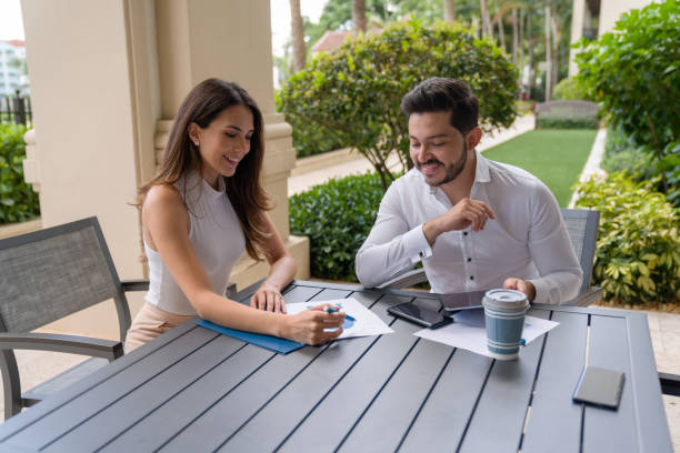istock Real estate agent reading a contract with her client 1316069357