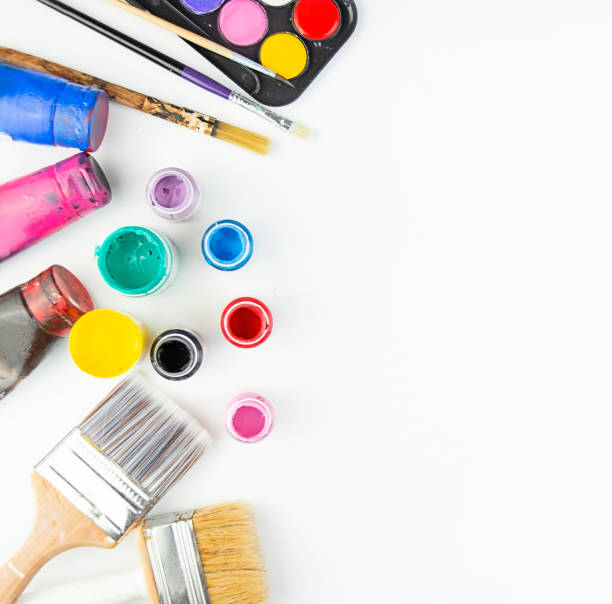 istock Watercolor paints and brushes for painting on a white table. Flat lay. Copy space. 1316072280