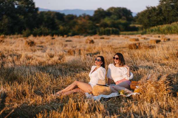 istock Two country woman relaxing on a hay 1316074220