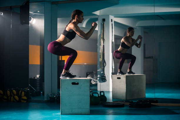 istock A young female doing a box jump in the gym 1316074953