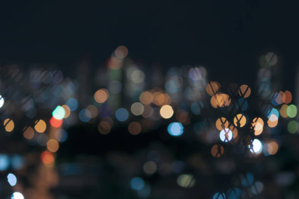 istock Bokeh colored lights city, abstract background, space for text. Isolated in a black background. 1316075292