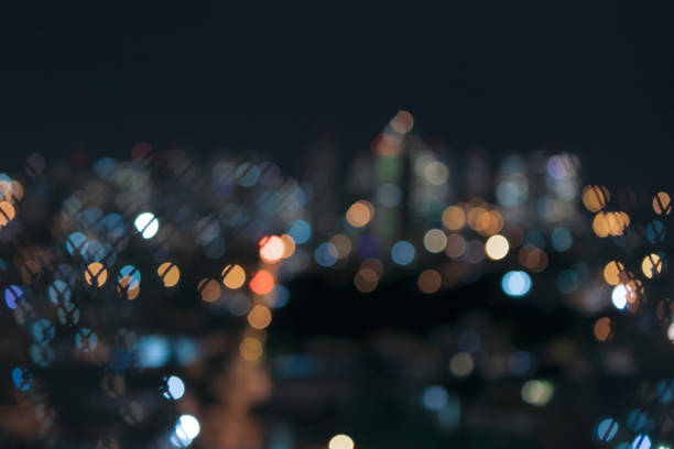 istock Bokeh colored lights city, abstract background, space for text. Isolated in a black background. 1316075294