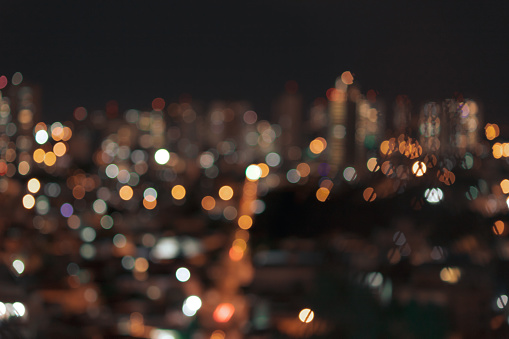 Bokeh colored lights city, abstract background, space for text.
