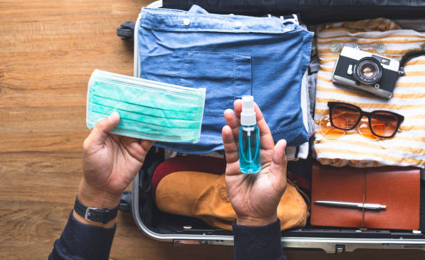 Protect yourself with mask in coronavirus,covid-19 outbreak.body health care and medical Protect yourself with mask in coronavirus,covid-19 outbreak.body health care and medical.summer, travel on reopen country priority baggage tag stock pictures, royalty-free photos & images