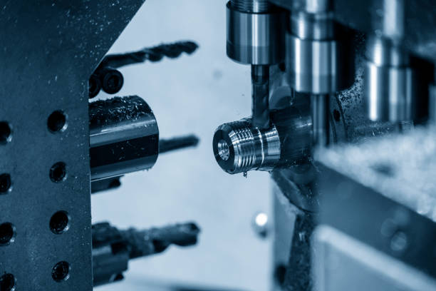 istock The  operation of multi-tasking CNC lathe machine swiss type tapping on the pipe connector parts. 1316079420