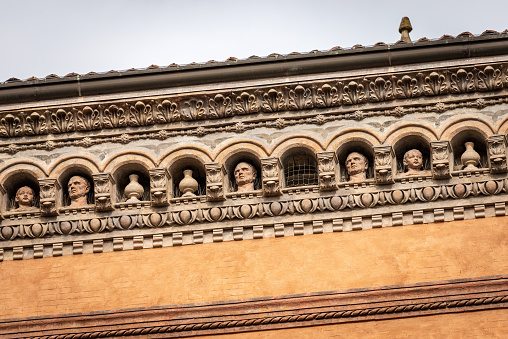 Bologna, Italy, - Feb 23th, 2020: Closeup of the Palazzo Isolani. Ancient palace in Gothic and Renaissance style (1451-1455) in Piazza Santo Stefano, Bologna downtown. Emilia-Romagna, Italy, Europe.