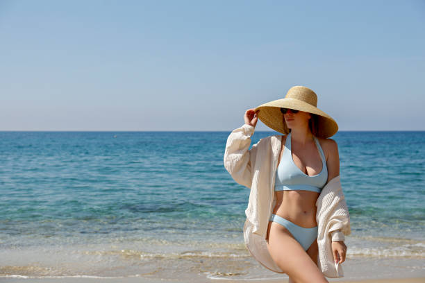 istock Fashion model on the beach 1316081240