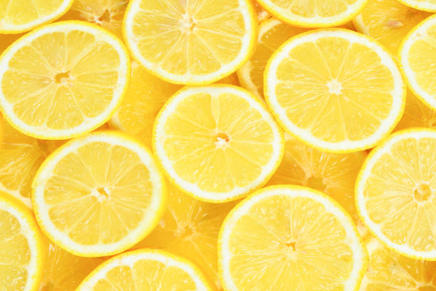 istock A slices of fresh juicy yellow lemons.  Texture background, pattern. 1316081468