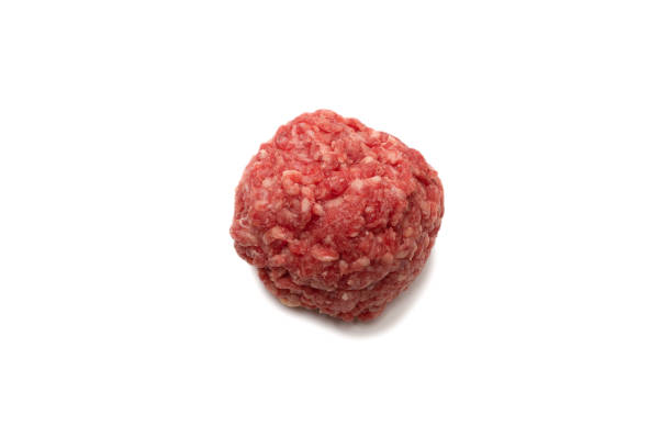 istock Raw meat balls isolated on white background. 1316081489
