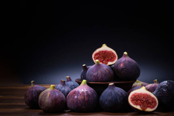 istock Tasty figs on a black background. Top view. 1316081511