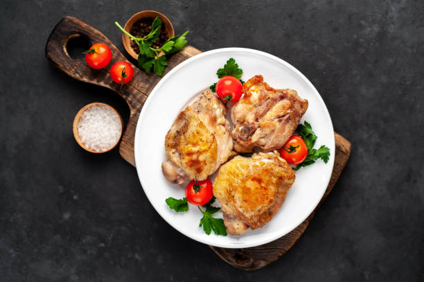 istock grilled chicken thighs on a white plate with spices on a stone background 1316082751