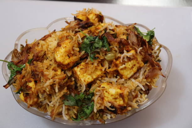istock Paneer Biryani in bowl at wood concrete background 1316084498
