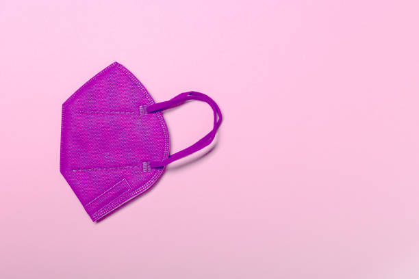 istock Creative minimal flat lay layer with KN95 or N95 FFP2 mask for protection 1316085960