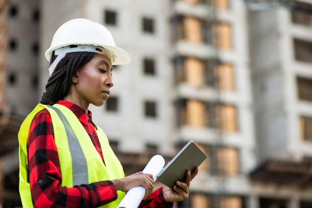 istock Businessman - Woman at construction site using digital tablet 1316086420