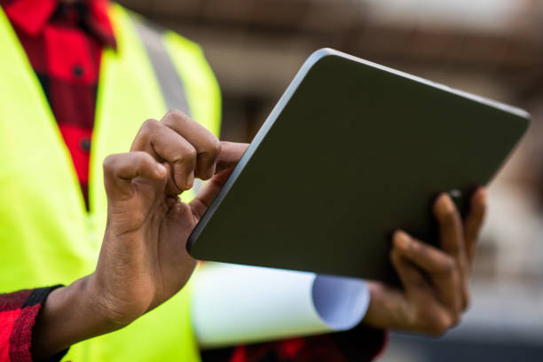 istock Businessman - Woman at construction site using digital tablet 1316086425