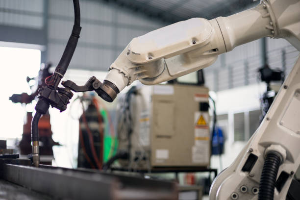 istock Automatic robotic arm is working in the factory. 1316086426