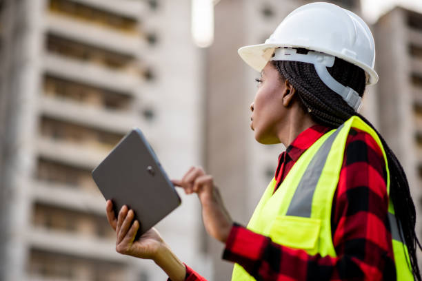istock Businessman - Woman at construction site using digital tablet 1316086457