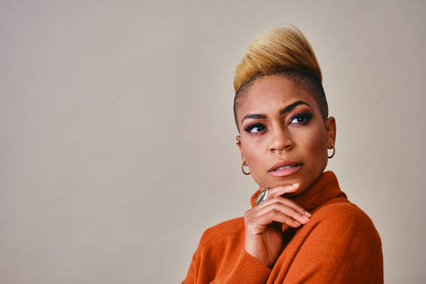 istock Contemplated Female Hipster Against Gray Background 1316088154