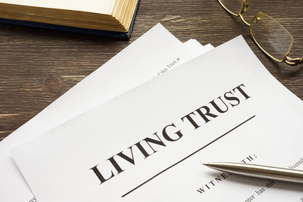 istock Living trust papers with pen and book. 1316089382