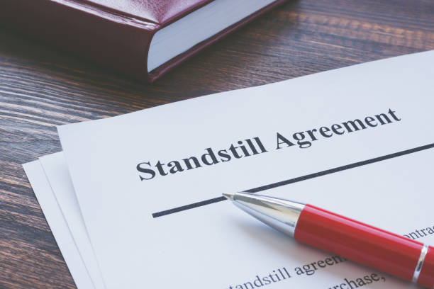 istock Legal term Standstill Agreement information and red pen. 1316089753