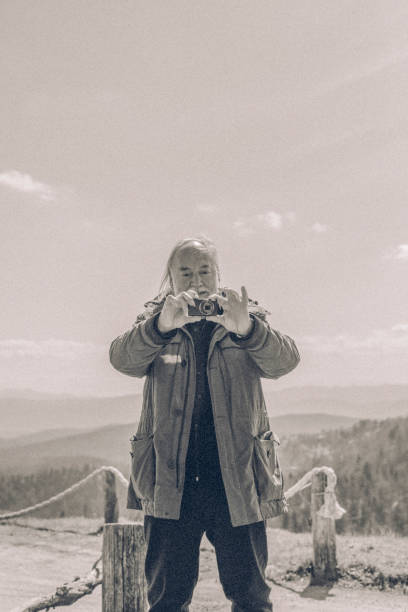 istock Hiker relaxes on mountain ridge in the morning 1316090023