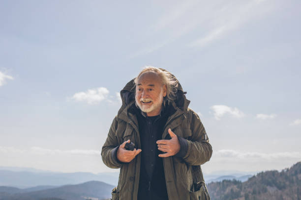 istock Hiker relaxes on mountain ridge in the morning 1316090096
