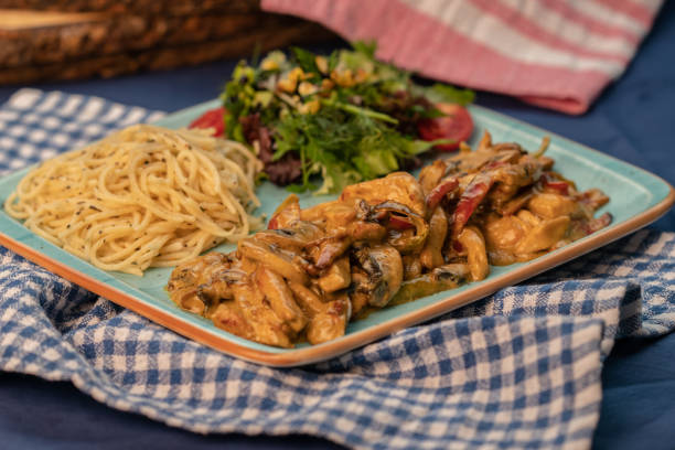 istock Chicken with curry sauce, salad and spaghetti 1316090909