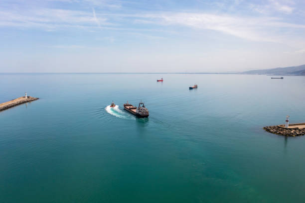 istock Aerial view of cargo ship leaving port. 1316091549