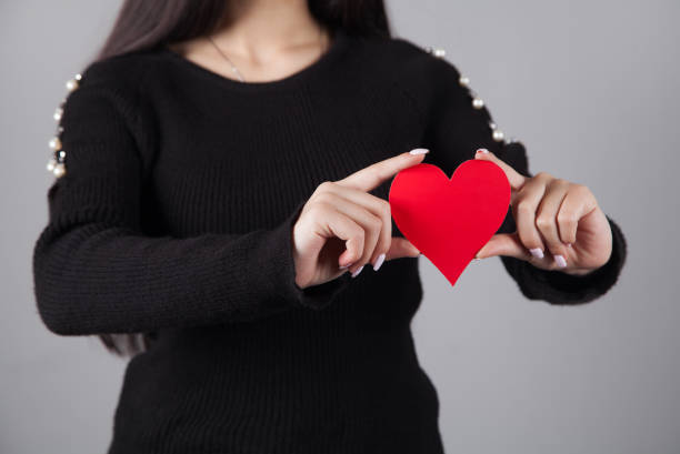 istock Woman with a red heart in her hand. 1316092450