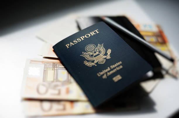 istock Passport and money on the table 131609505