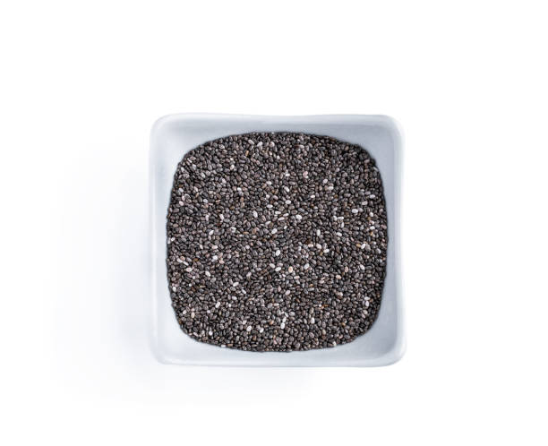 istock Chia seeds in a white bowl isolated on white 1316095724