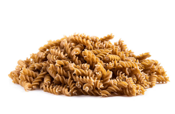 istock Whole grain fusilli isolated on white 1316095892