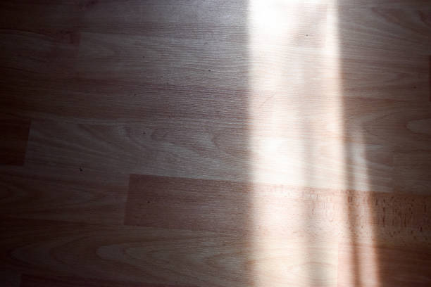 istock Wooden floor with shadows indoors 1316100643
