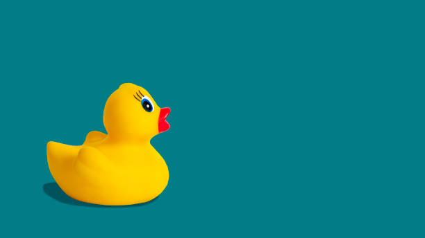 istock Yellow rubber duck on a blue background 1316107830