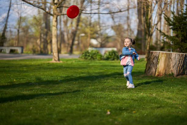 istock Little girl playing freesbie 1316110079