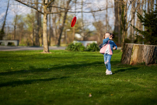 istock Little girl playing freesbie 1316110085