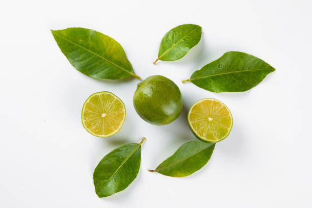 istock Ripe green lemon fruit on white background 1316112533