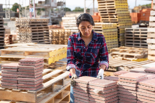 istock Latin american female stacking tiles on pallet 1316121208