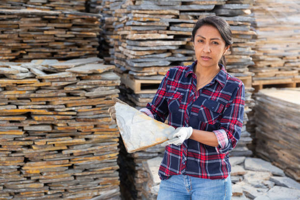 istock Hispanic woman worker posing with natural stone tile 1316121224