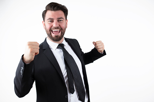 Businessman winning a suit celebrates his victory. excited businessman.
