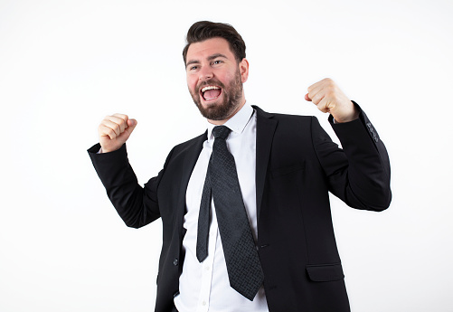 Businessman winning a suit celebrates his victory. excited businessman.