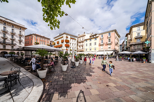Lugano, Switzerland - September 23, 2020: Street Cafe at Piazza della Riforma or Reformation Square, the main square in Lugano city in Ticino canton, Switzerland