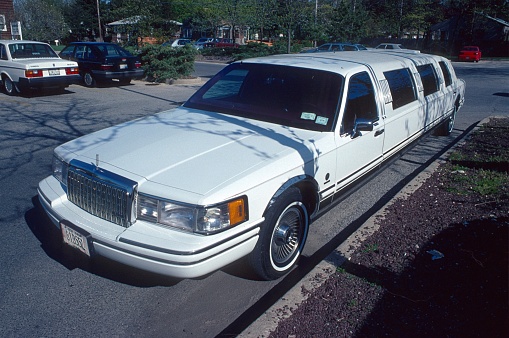 New York State, USA, 1985. Stretched limo parked in suburban New York City.