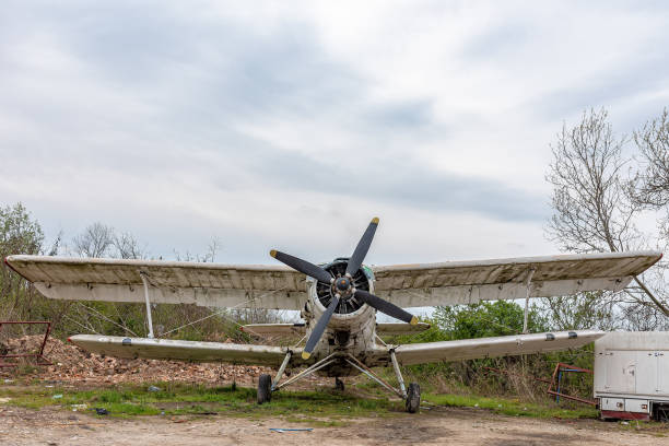 Old abandoned biplane in daylight