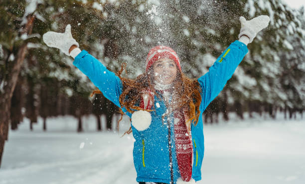 istock Winter. The woman is throwing snow. 1316127635